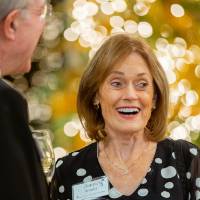 Donna Brooks talking with guests at the Foundation Holiday Reception